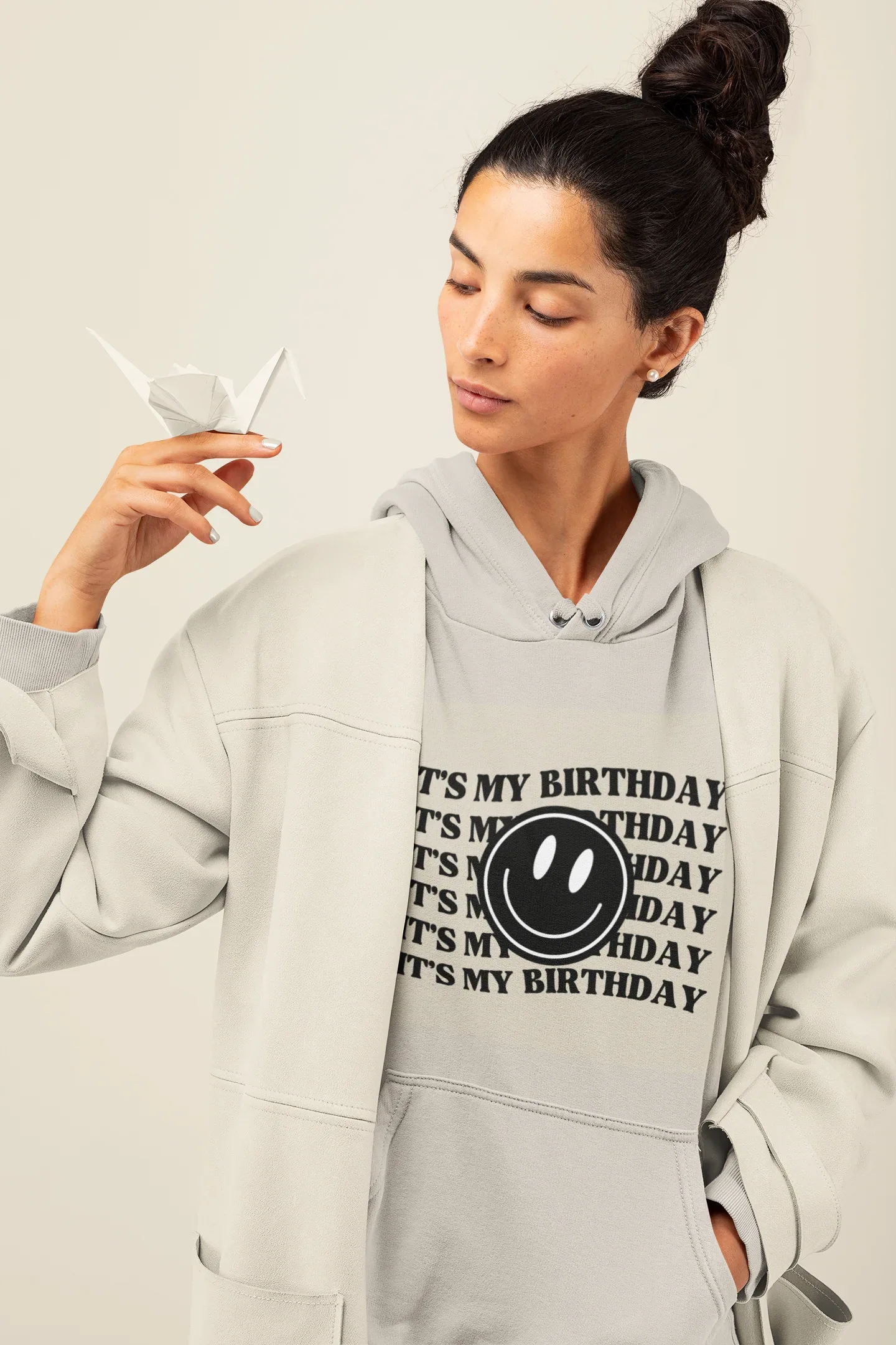 Light gray hooded sweatshirt with kangaroo pocket and birthday logo graphic print