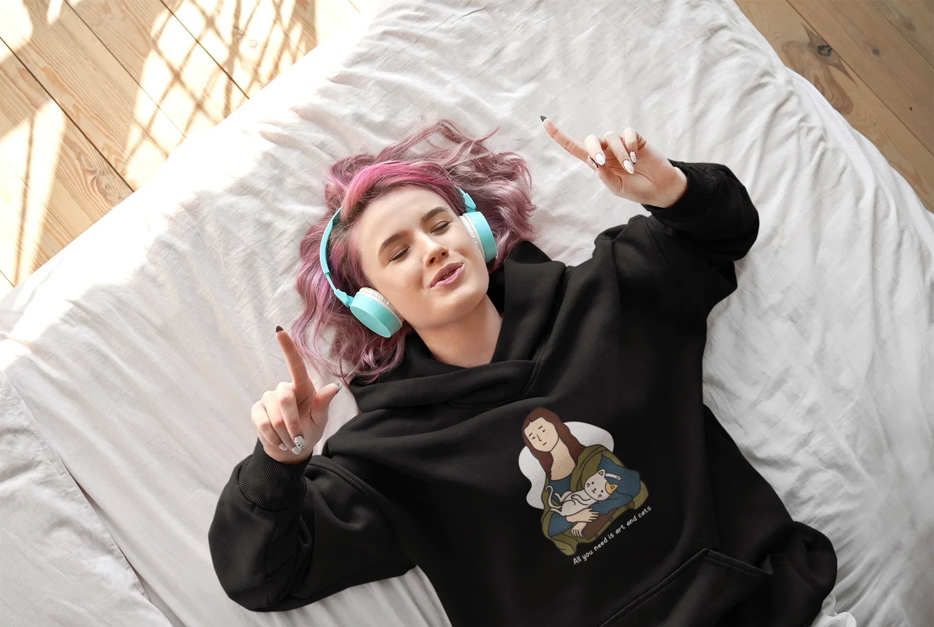 Black hoodie with cat-and-art graphic print on chest area