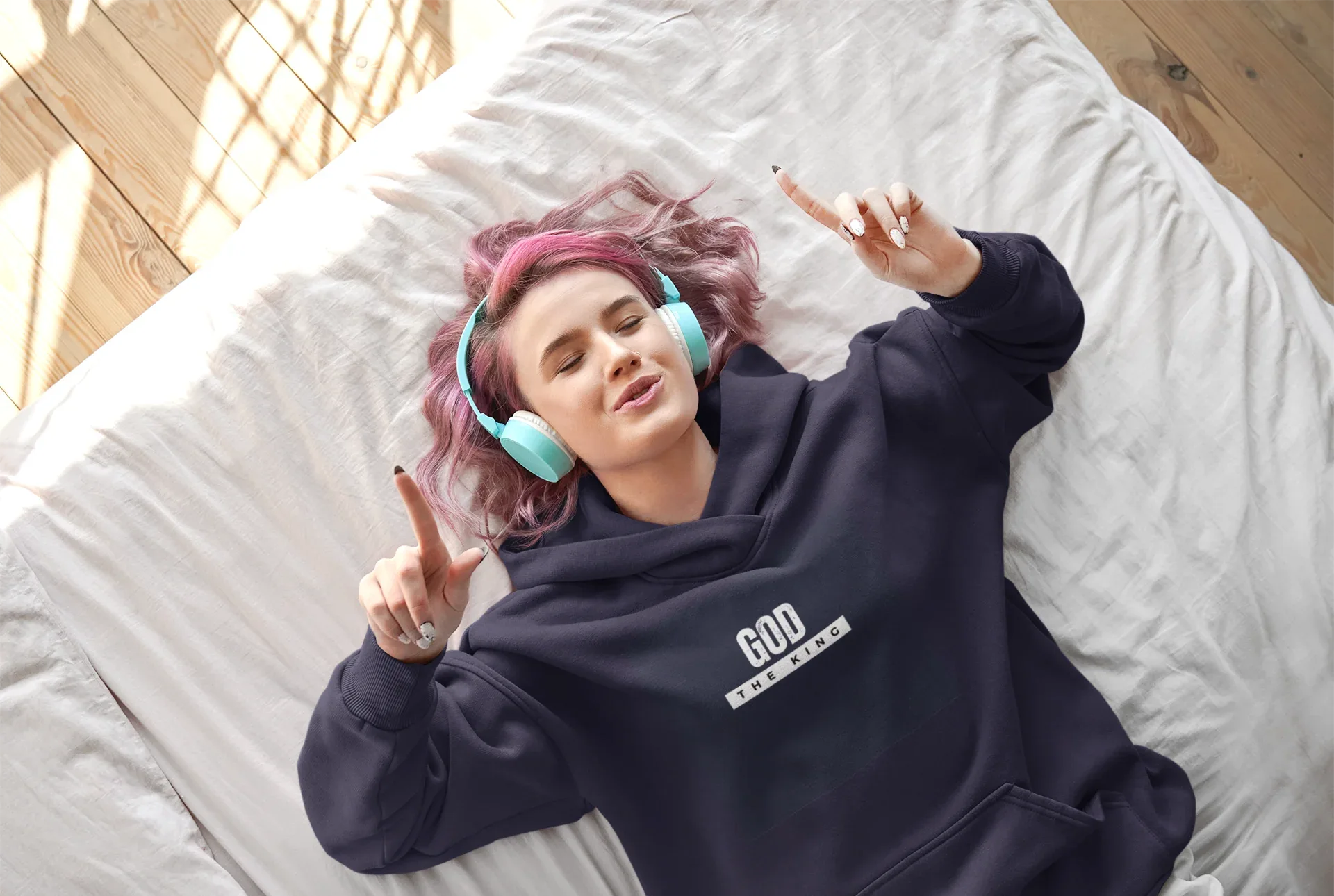 Navy hooded sweatshirt with 'GOD THE KING' chest logo and relaxed fit.