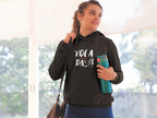 Black yoga hoodie with front graphic, drawstring hood, and kangaroo pocket.