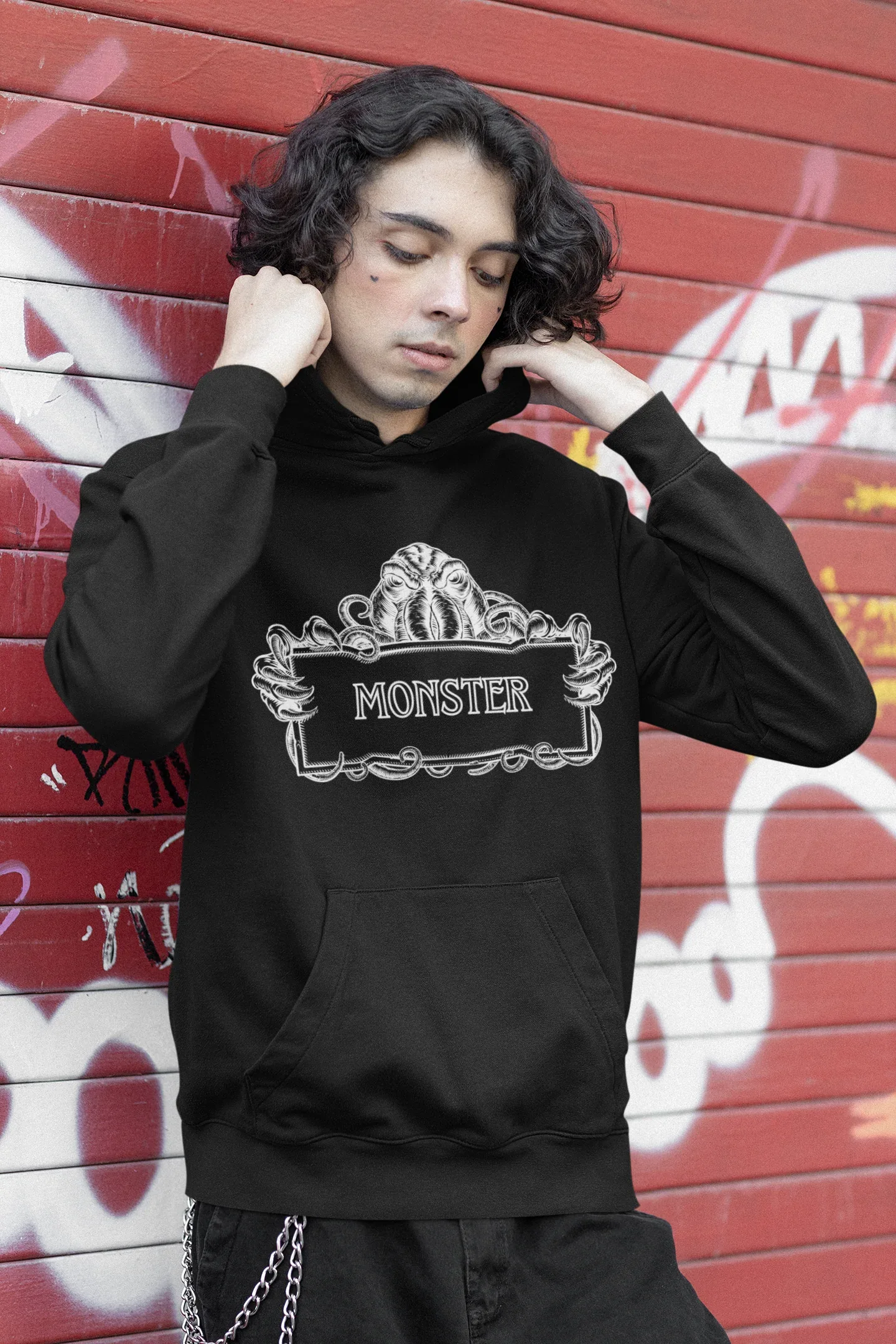 Black Monster Hooded Sweatshirt worn with white monster logo and front pocket