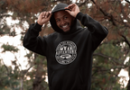 Black pullover hoodie with hood up and circular mountain “Adventure” logo on front.