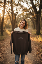Dark brown crewneck sweatshirt with centered planet logo text and heart