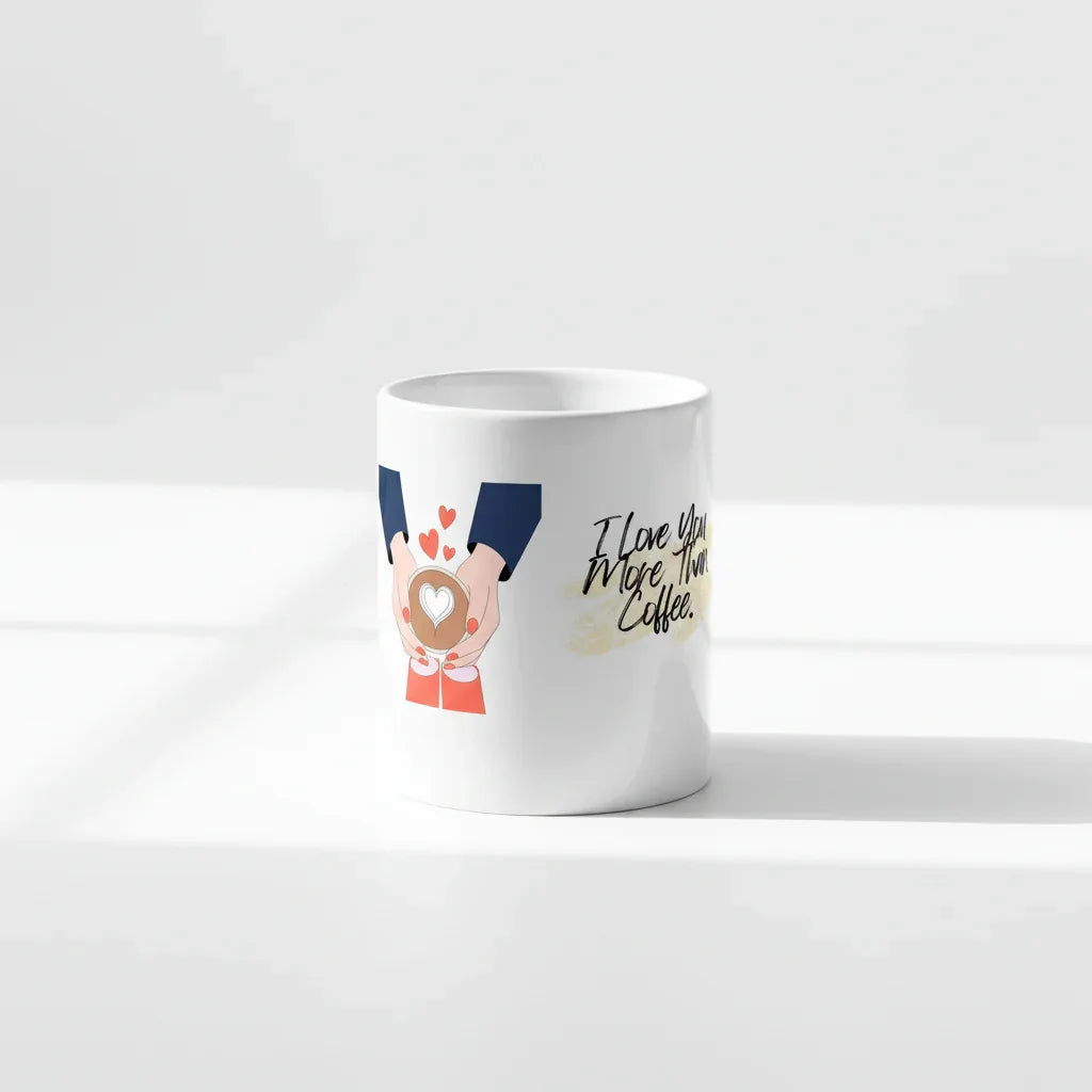 White ceramic coffee mug with blue-sleeved hands holding a heart and script message