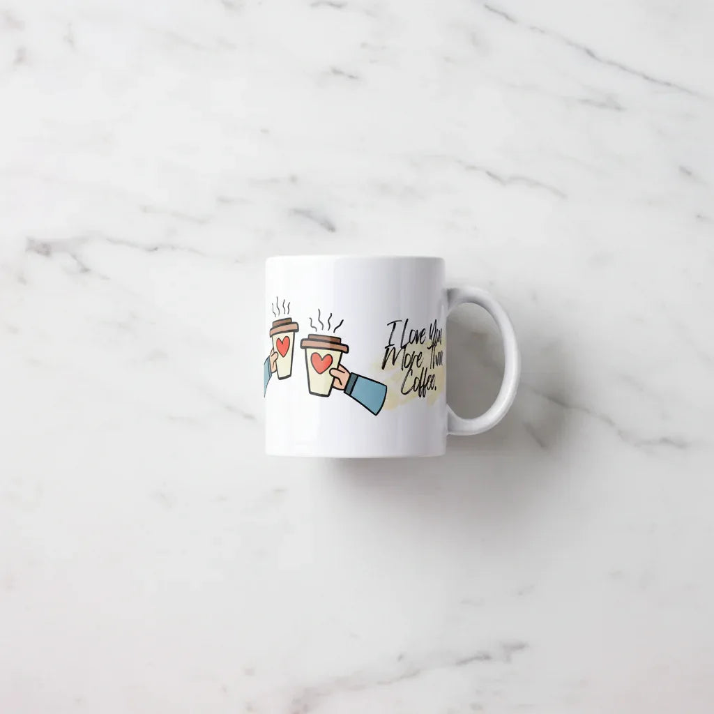 White ceramic coffee mug with heart coffee cups illustration and 'I Love You More Than Coffee.'