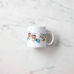 White ceramic coffee mug with heart coffee cups illustration and 'I Love You More Than Coffee.'