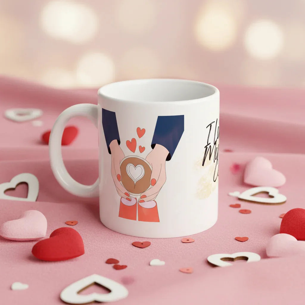 White ceramic coffee mug with blue-sleeved hands holding a heart and red heart icons