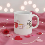 White coffee mug with coffee-and-heart illustration and cursive 'I Love You More Than Coffee.'