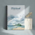 Erin's personalised coastal watercolour spiral notebook standing upright on a soft grey-blue linen surface with a dried flower stem and a folded card in a premium studio product photo