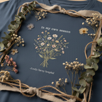 Dark blue crew-neck t-shirt with botanical bouquet graphic and 'In my own season' text