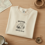 Ivory custom T-shirt with mountain graphic and text "Mentally" and "Off the Grid"