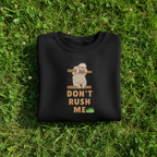 Black sloth graphic sweatshirt with "Don't Rush Me" text and small leaf accents