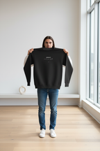Black crewneck sweatshirt with planet logo and heart graphic