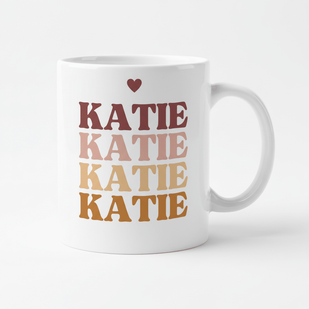 Personalised white mug with large stacked “KATIE” text and a small heart above.
