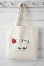 White personalized rose tote bag with red rose print and 'Kerry&Jeff' text