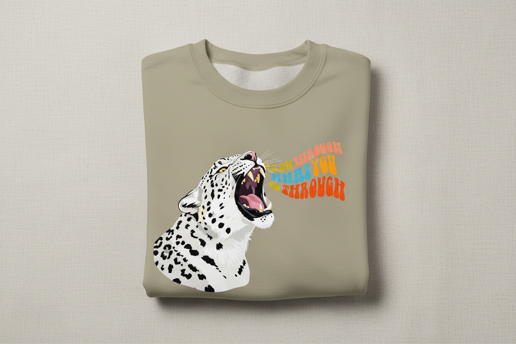 Khaki sweatshirt with leopard graphic featuring an animal face.