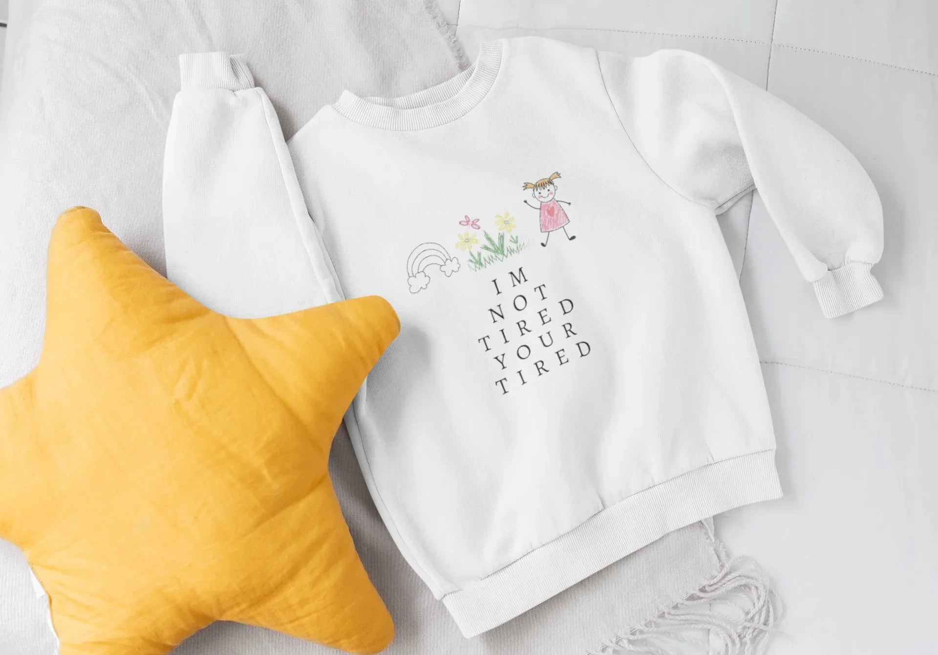 Arctic white kids sweatshirt with 'I'm Not Tired, You're Tired' character graphic