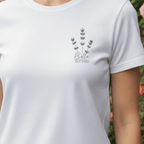 White t-shirt with lavender sprig graphic and “Bella” with EST/2020