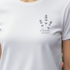 White t-shirt with lavender sprig graphic and “Hannah” with EST/2020
