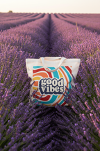 Canvas tote bag with 'good vibes' front print in teal, orange, and red swirl