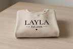 Cream crewneck sweatshirt with LAYLA and Est.2006 print