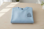 Light blue crewneck sweatshirt with "Good things ahead" logo graphic
