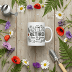 White ceramic Retired Time to Garden mug with watering can and flowers