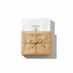 Folded T-shirts: white and tan, each with a “Plant life” graphic and leaf logo