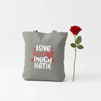 Gray tote bag with 'LOVE YOU MUCH KATIE' heart text print.