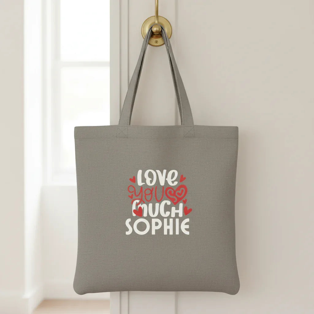 Grey tote bag with printed hearts and text: “LOVE YOU MUCH SOPHIE”