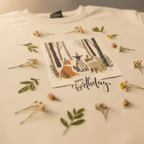 Cream sweatshirt front with woodland animals and Happy Birthday print