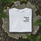 White T-shirt with 'I have two names' print and heart icon, crew-neck front.