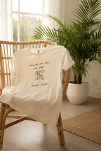 Cream T-shirt with “mama est. 2021” script, small floral bouquet graphic, and “Rosie • Jack”