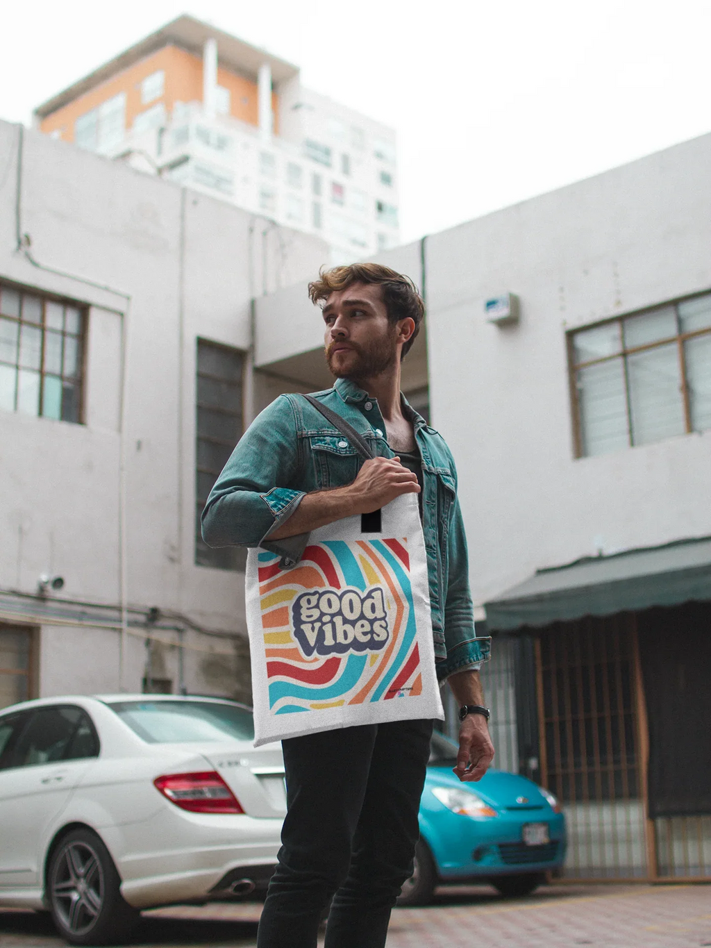 White tote bag with rainbow waves and “good vibes” print, cotton handles