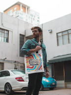 White tote bag with rainbow waves and “good vibes” print, cotton handles