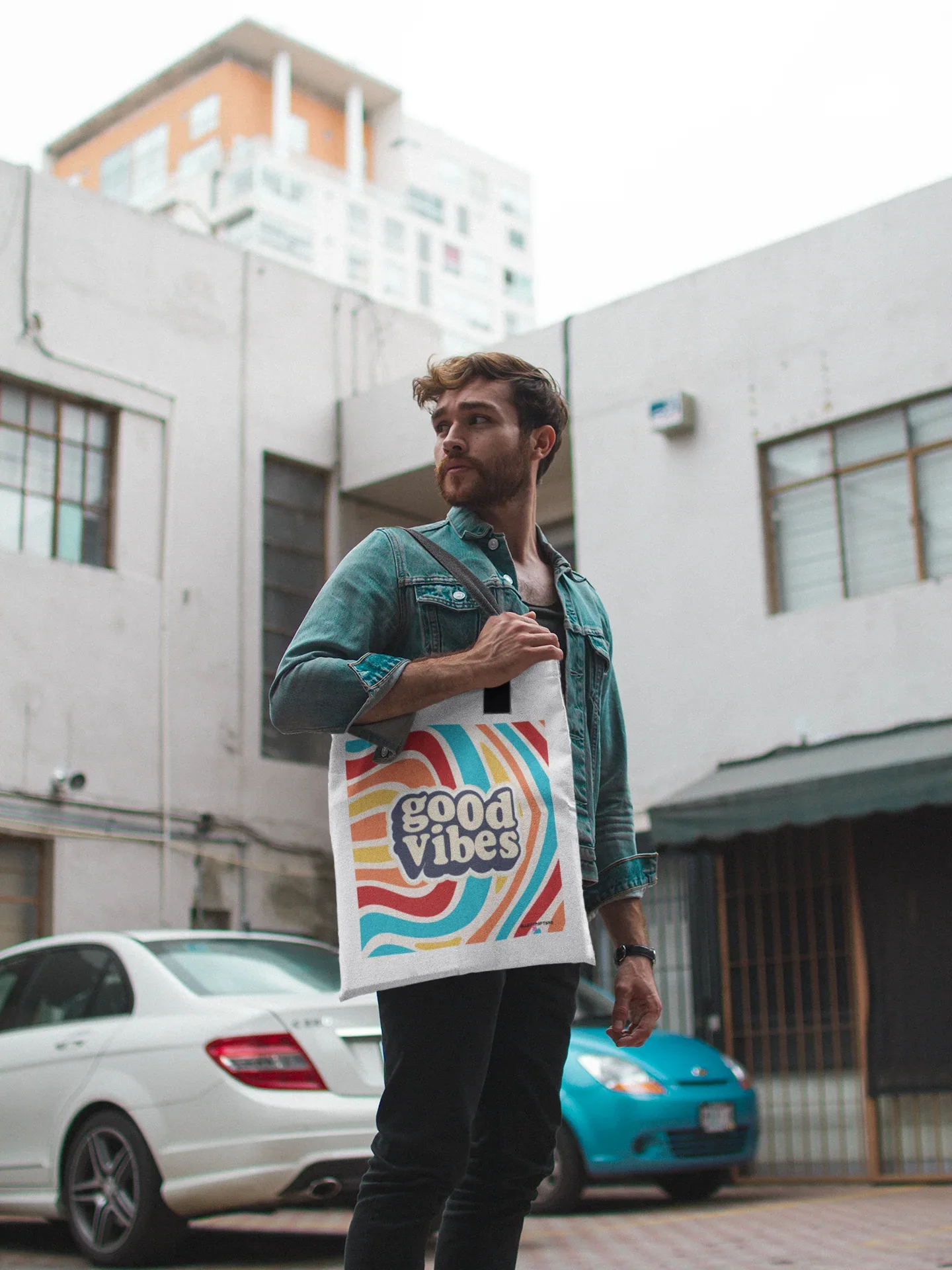 White tote bag with rainbow waves and “good vibes” print, cotton handles