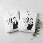 White personalized hoodie with front couple graphic, hood, and kangaroo pocket.
