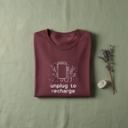 Unisex T-shirt in maroon with unplug to recharge phone graphic