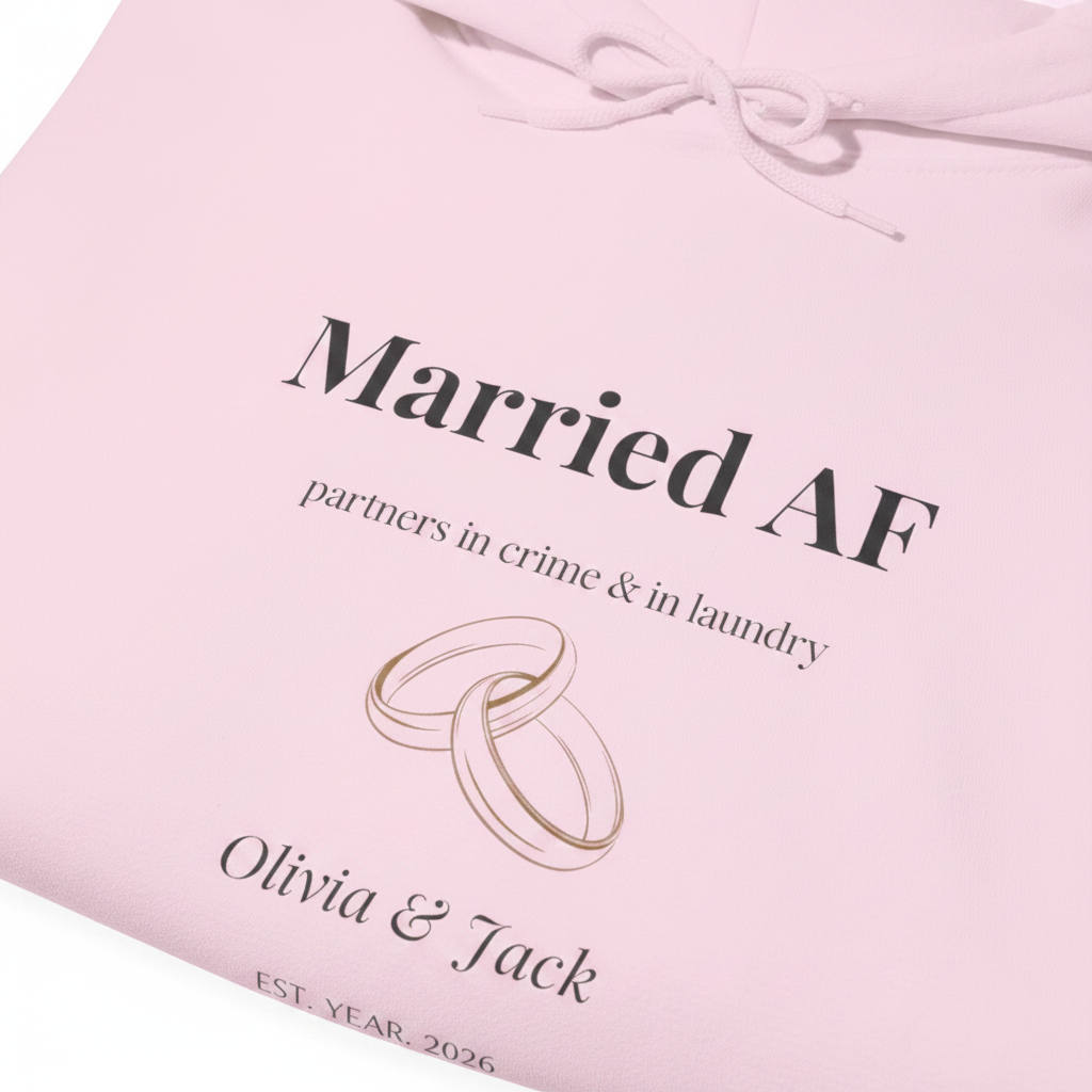Light pink hoodie with “Married AF” print, partners line, ring graphic