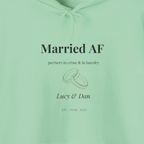 Mint green hoodie with “Married AF” text, partner line, ring graphic