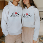 White couples hoodie set with heart monogram graphic on chest, front view