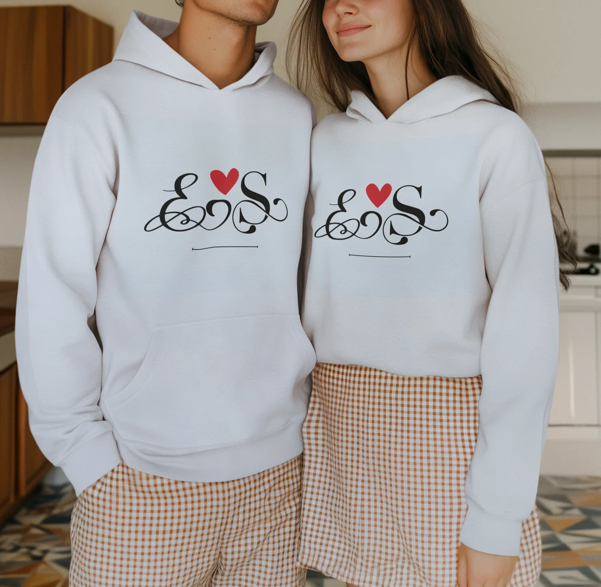 White couples hoodie set with heart monogram graphic on chest, front view