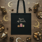 Black cotton tote bag with “Maya’s eid treats” text and gift illustration
