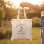 White tote bag held in hand with “There’s No Better Friend” and flower “than you” text