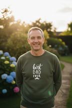 Olive crewneck sweatshirt with white 'best DAD ever' print, worn by smiling man