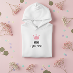 White hooded sweatshirt with pink crown logo and “MINI QUEEN” front print