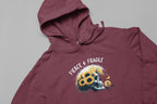 Maroon hooded sweatshirt close-up with sunflower skull graphic and Fierce & Fragile text
