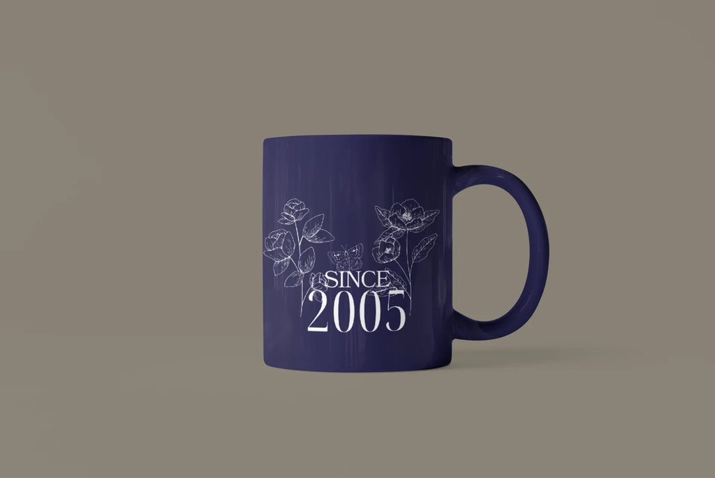 Blue ceramic mug with floral line art and “SINCE 2005” text