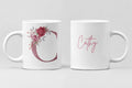 Pair of white ceramic mugs: floral letter C and pink cursive name Cathy.