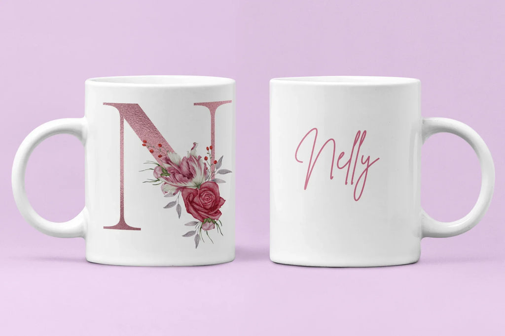 Pair of white ceramic mugs: floral letter N and pink cursive name Nelly.